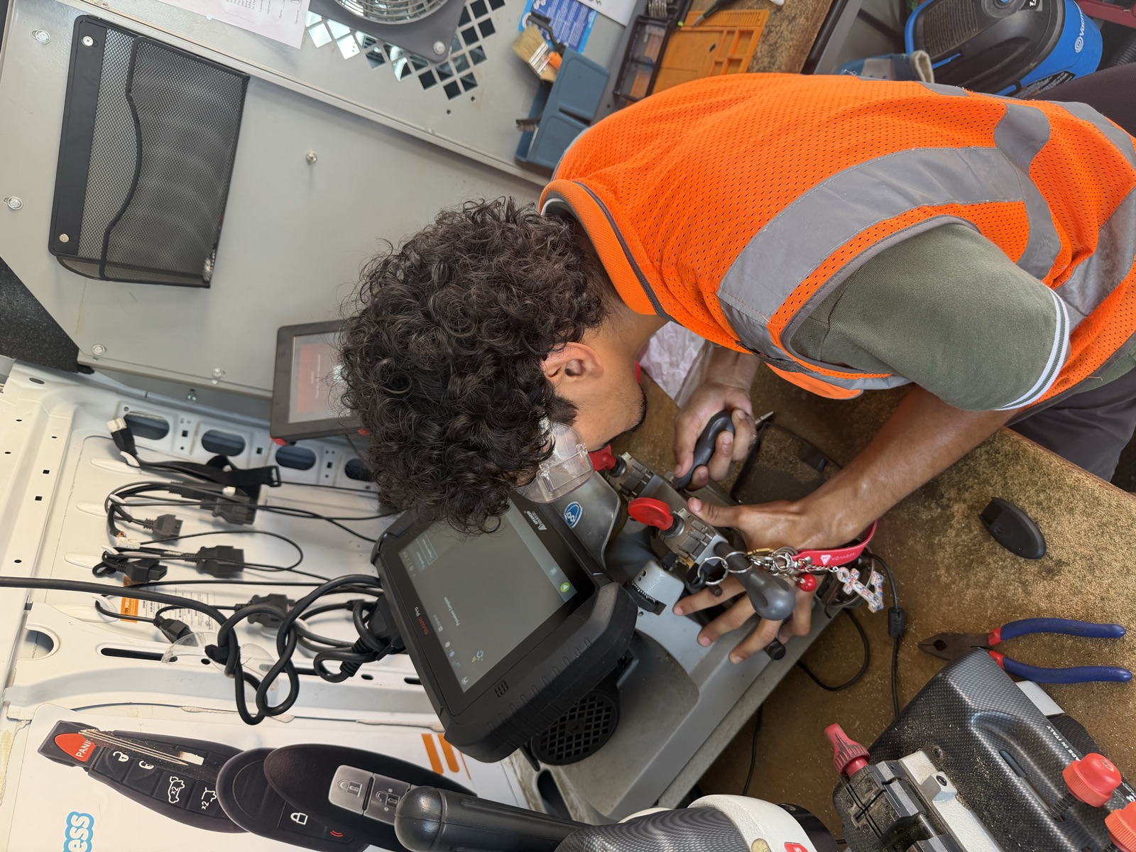 Technician programming a key at the equipment bench